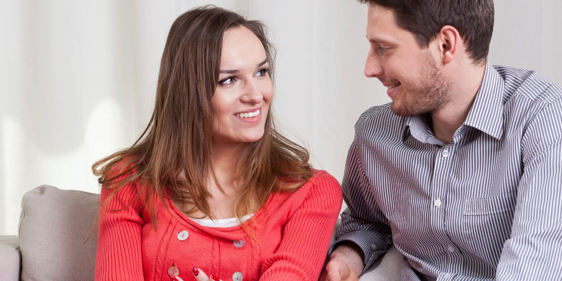 Couple communicating on a couch